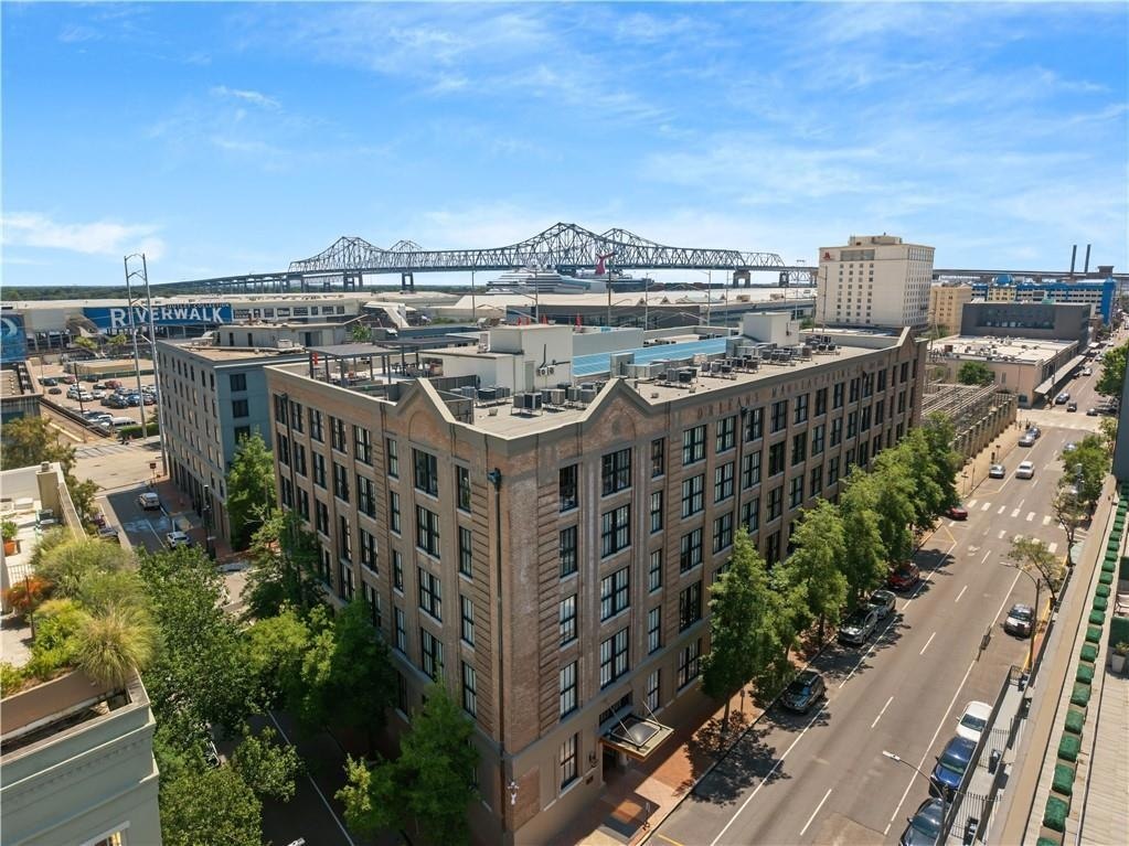 700 South Peters brick building with the Crescent City Connection beyond